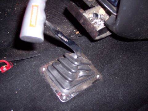 1972 Ford Ranchero - Close-up of a vehicle's interior, focusing on a floor-mounted shifter with a distinctive shift knob.