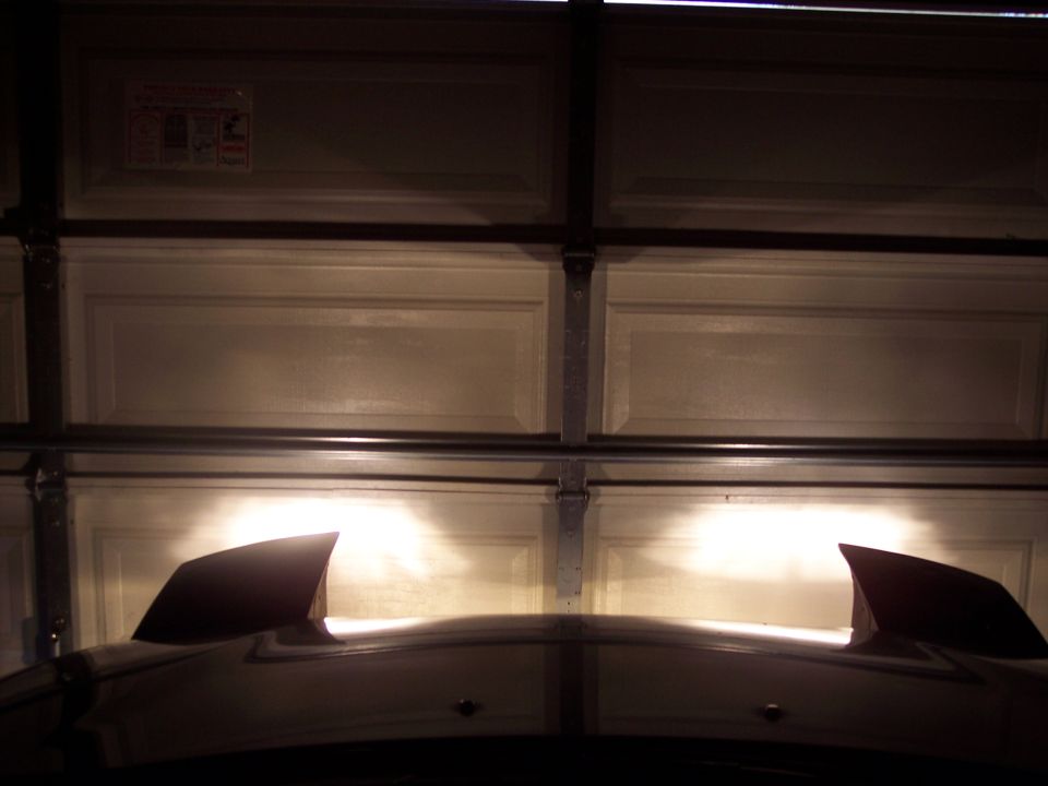 car headlights on in a garage