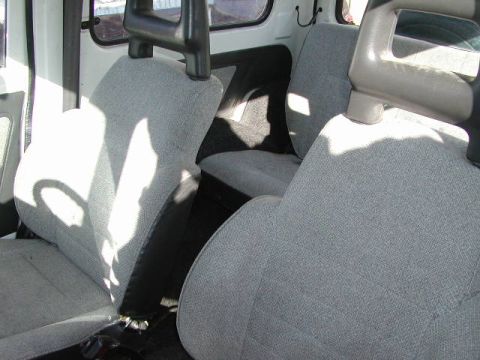 1979 Ford F-150 - Interior view shows grey fabric seats and headrests.