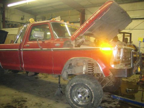 1979 Ford F-150 - 1979 Ford F-150 pickup truck undergoing maintenance in a workshop.