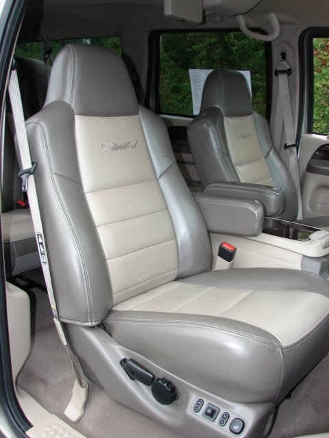 2002 Ford Excursion - Interior view of a 2002 Ford Excursion, highlighting the two-tone leather seats with 'Limited' badging.