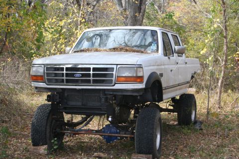 1993 Ford F-350 - The truck as it stood before hacking the old axles off, far from completed, with 12" lift on 35's.