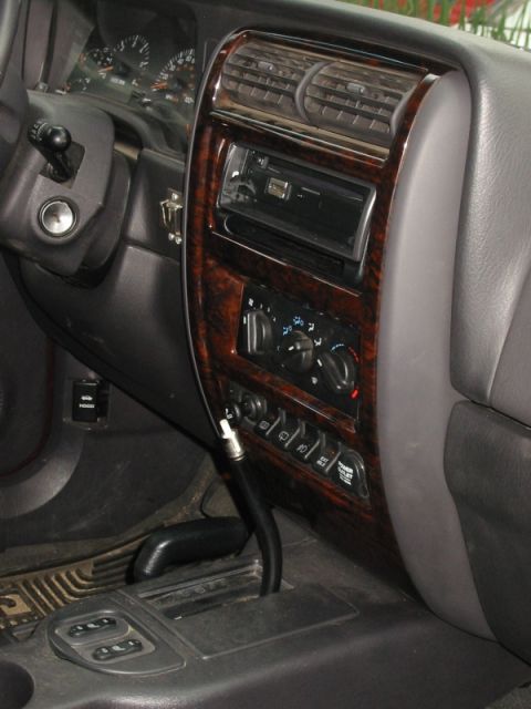2000 Jeep Cherokee - Interior view of a 2000 Jeep Cherokee, highlighting the dashboard and center console details.