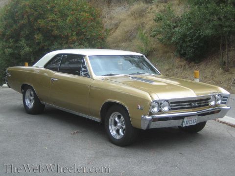 1968 Ford Mustang - This gold 1967 Chevrolet Chevelle SS coupe features a white vinyl roof and is captured in a front three-quarter view.