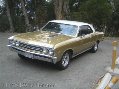 1968 Ford Mustang - Gold 1967 Chevrolet Chevelle SS coupe with a white roof, parked outdoors.