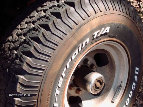 2001 Ford F-350 - A close-up view of a BFGoodrich All-Terrain T/A KO tire and wheel assembly.