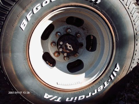 2001 Ford F-350 - A close-up view of a tire and wheel assembly, showing tread and rim details.