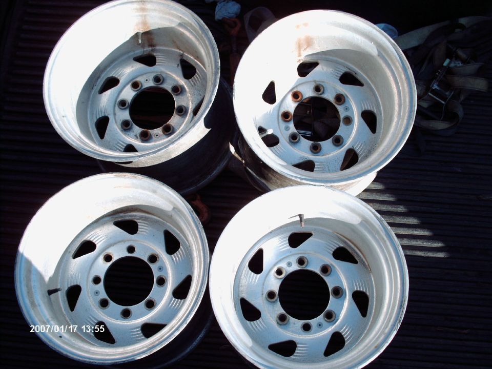 Four aluminum alloy wheels with a 10-lug pattern