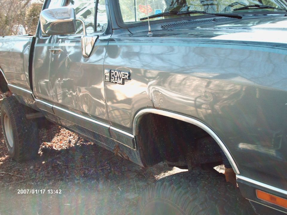 Side view of a gray Dodge Power Ram pickup truck