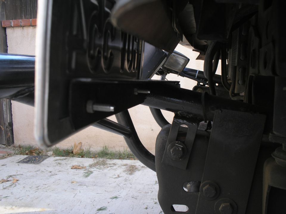 better day time shot of plate bracket.  used a plate frame to stiffen the plate to keep from rubbing body.