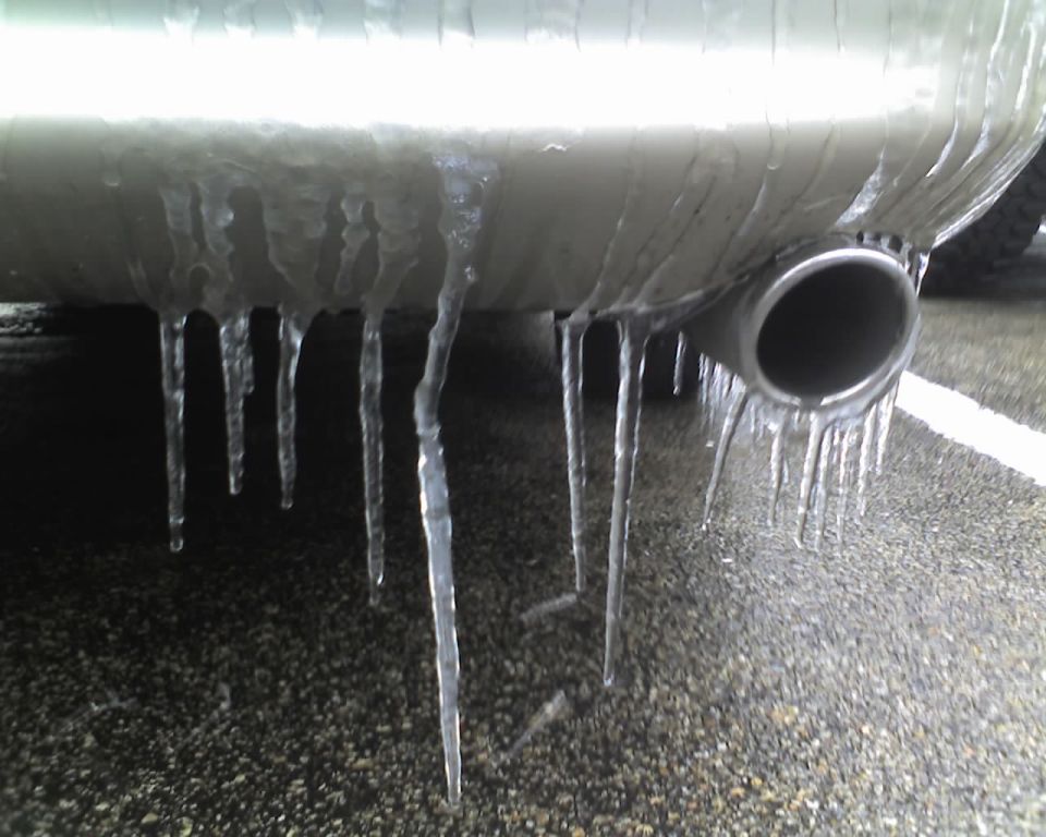 Exhaust pipe covered in icicles