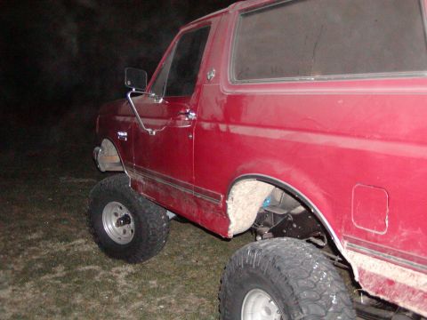 1991 Ford Bronco - This red Ford Bronco appears to be from the 1992 model year, not 1991 as claimed.