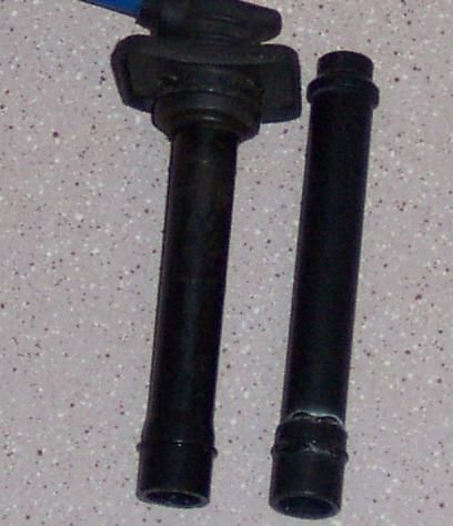 1994 Ford Probe - Two ignition coils are shown, one with a blue wire connected to its top.