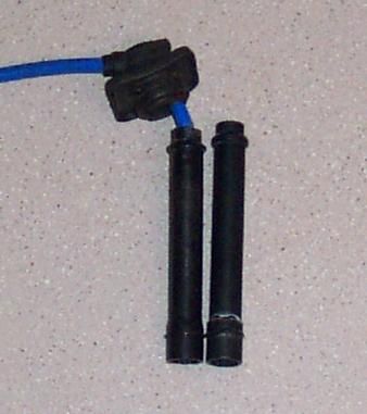 1994 Ford Probe - Close-up of spark plug wires and boots, a component of a vehicle's ignition system.