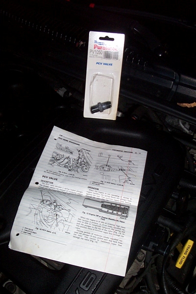 1999 Chrysler 300M - A new PCV valve and its installation diagram are shown on top of engine components.