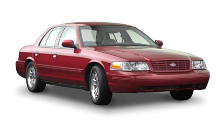 2002 Ford Crown Victoria - A red 2002 Ford Crown Victoria is shown from the front three-quarter angle against a white background.