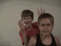 1993 Ford Bronco - Two young boys are captured in a photo, both raising their hands as if to wave.