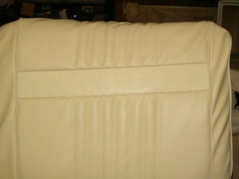 1967 Ford Ranchero - Close-up of beige car seat upholstery, showing its textured pattern and stitching detail.