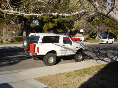 1996 Ford Bronco - This 1996 Ford Bronco is equipped with a rear-mounted spare tire and a red jerry can.
