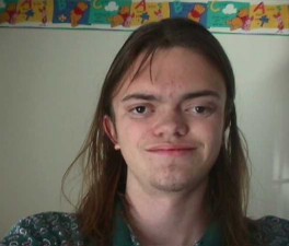 1991 Ford Bronco - A person with long brown hair and a patterned shirt smiles at the camera.