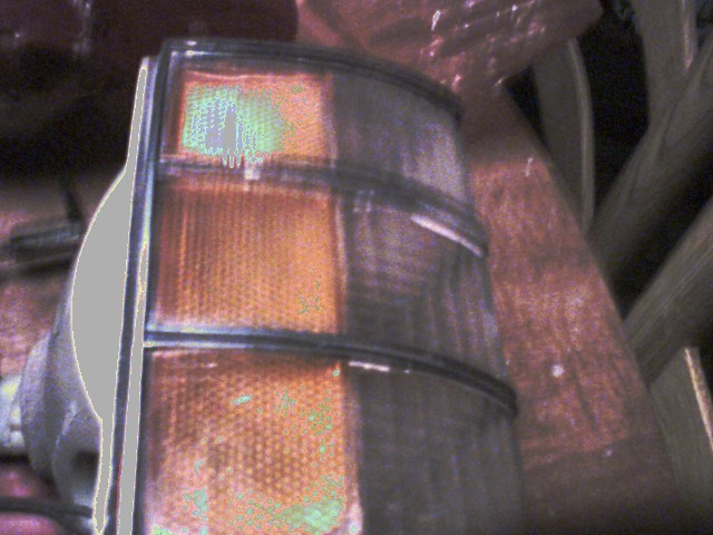 Car tail light assembly with amber and clear sections