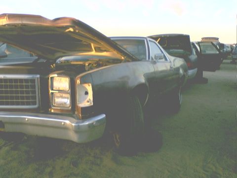1973 Ford Ranchero - This car appears to be a 1977 Ford Ranchero, not a 1973 model, with its hood open and one headlight missing.