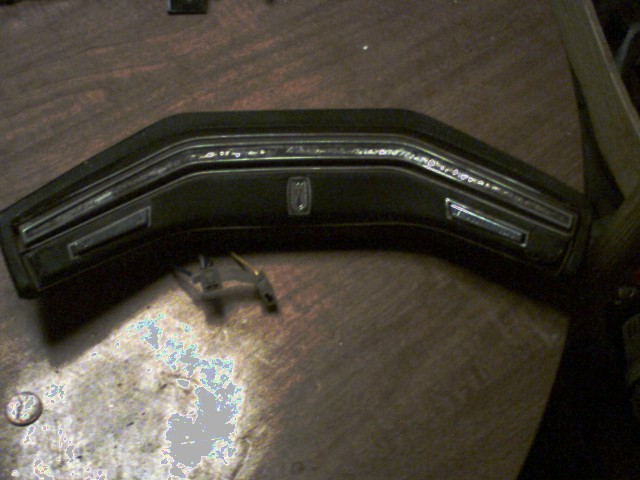 Black dashboard trim with chrome accents and a central emblem