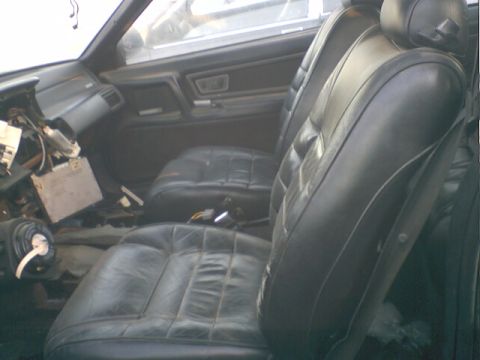 1973 Ford Ranchero - Interior view of a car with damaged dashboard and leather seats.