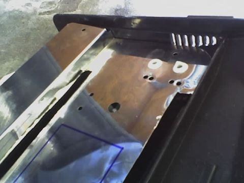 1993 Ford C-350 (Centurion Conversions) - This image shows a close-up view of a vehicle's interior component, metallic and black finishes.