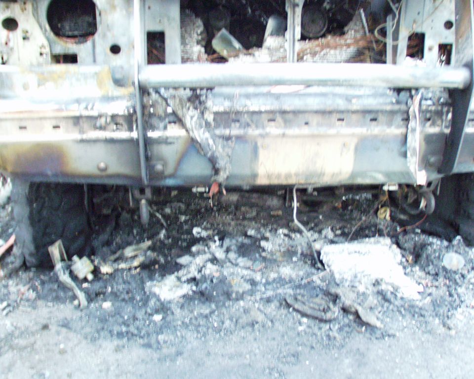 Burned 1989 Ford Bronco front end with grille and bumper destroyed