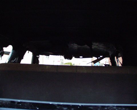 1989 Ford Bronco - Interior of a vehicle showing extensive damage, likely from a fire.