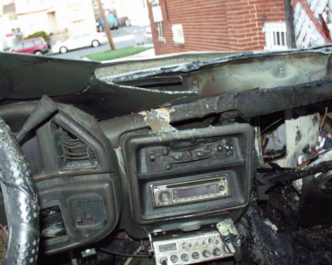 1989 Ford Bronco - The interior of a 1989 Ford Bronco shows extensive fire damage to the dashboard and steering wheel.