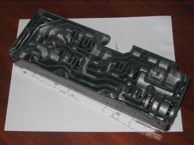 Transmission valve body with intricate internal channels
