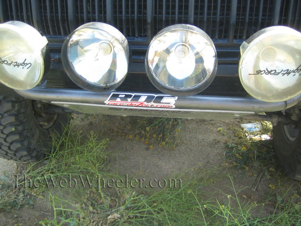Front bar with four Lightforce driving lights on a dark off-road vehicle