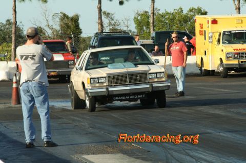 1985 Ford Crown Victoria LTD - A 1985 Ford Crown Victoria LTD is seen on the drag strip, modified with a hood scoop.