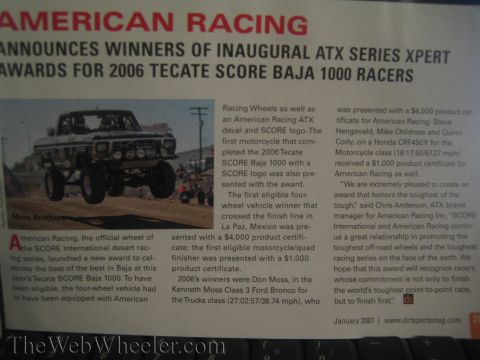 1990 Ford Bronco - printed magazine page headlined 'American Racing' announcing winners of the 2006 Tecate SCORE Baja 1000 with a desert race photo.