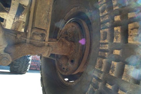 1978 Dodge Power Ram - Close-up view of a truck's rear suspension and tire, with a Supermotors.net logo visible.