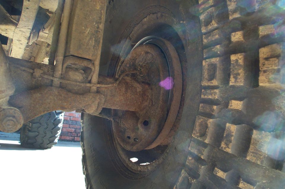 Truck rear suspension and tire with Supermotors.net logo