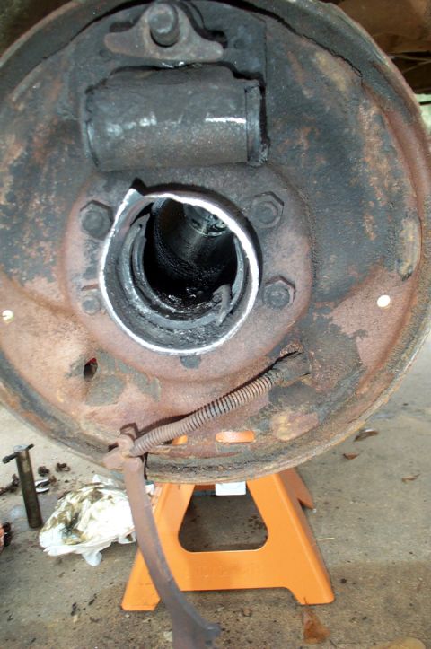1978 Dodge Power Ram - Rusty brake drum assembly with a damaged wheel cylinder, likely needing replacement.