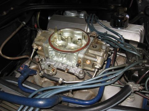 1968 Shelby GT500 - This photo shows a detailed view of a vehicle's engine, focusing on the carburetor and associated wiring.