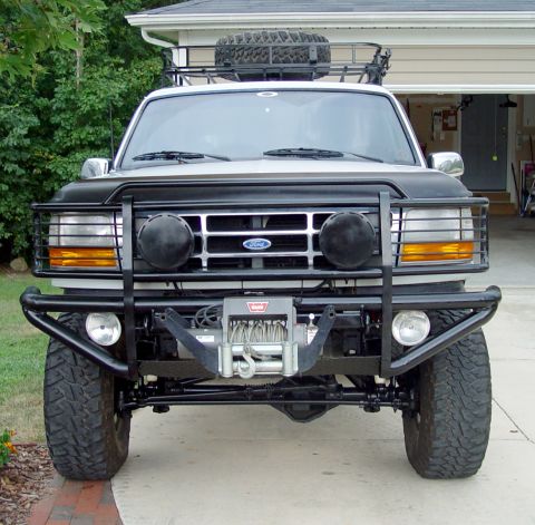 1996 Ford Bronco - This modified Ford Bronco features a heavy-duty bumper and winch, suggesting off-road use.