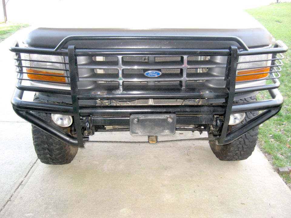 Ford truck front end with black tube grille guard and bumper removed
