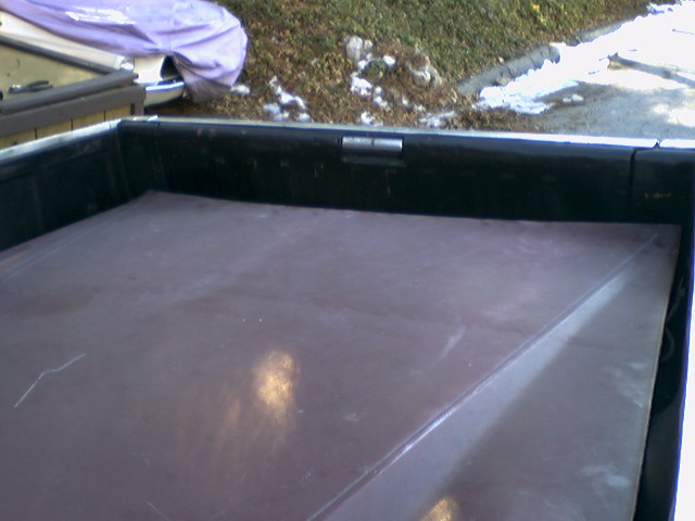 Truck bed with a tonneau cover