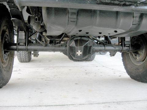 1996 Ford Bronco - Rear axle assembly with differential cover and suspension components visible from below.