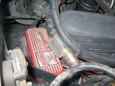 1996 Ford Bronco - Close-up view of engine bay components, including an MSD ignition box and various hoses.
