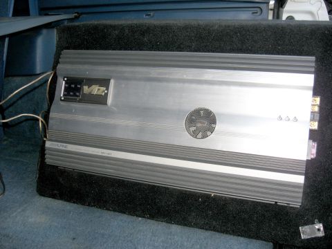 1996 Ford Bronco - Alpine V12 car amplifier with visible wiring and connections.