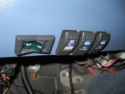 1996 Ford Bronco - Aftermarket switches for ARB compressor and front/rear air lockers are visible in the vehicle's interior.