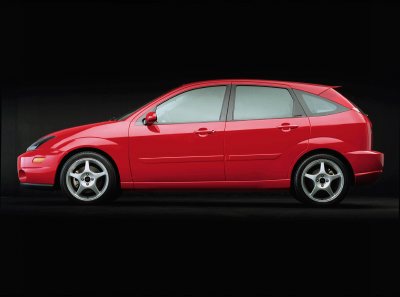 2003 Ford Focus - Side profile of a red 2003 Ford Focus hatchback against a black background.
