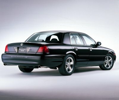 2003 Mercury Marauder - A black 2003 Mercury Marauder is shown from the rear 3/4 angle against a light gray background.