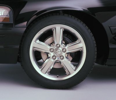2003 Mercury Marauder - Close-up of the front wheel and fender of a black 2003 Mercury Marauder.